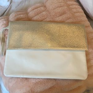 SOLD Brand New Never used Clarins Gold and White clutch purse
